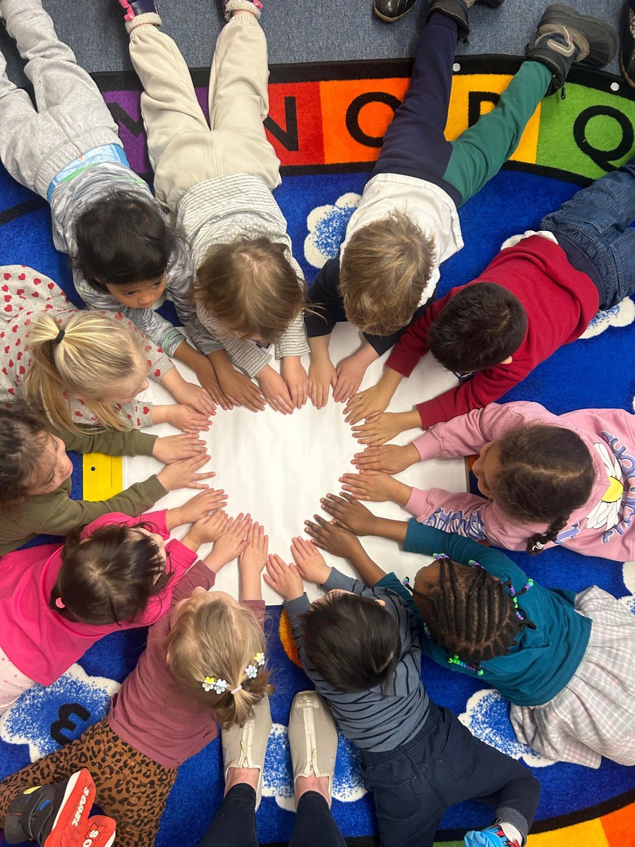 kids forming a heart with their hands